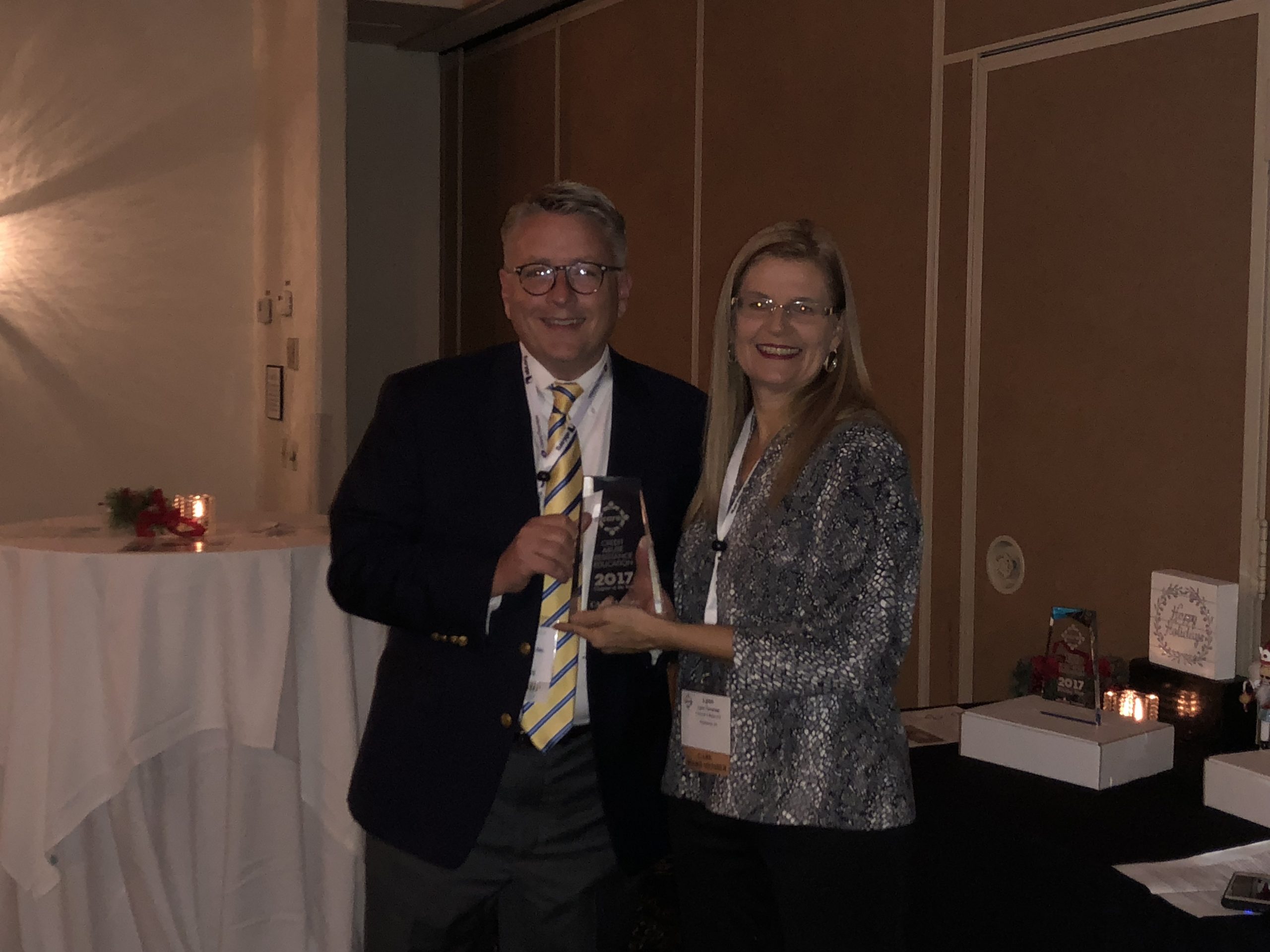 Jeff Cavender (Troutman Sanders) accepts the 2018 Chapter of the Year Award for the CARE Altanta Chapter. The award was presented by the CARE Board Chairwoman Lynn Tavenner (Tavenenr & Beran).